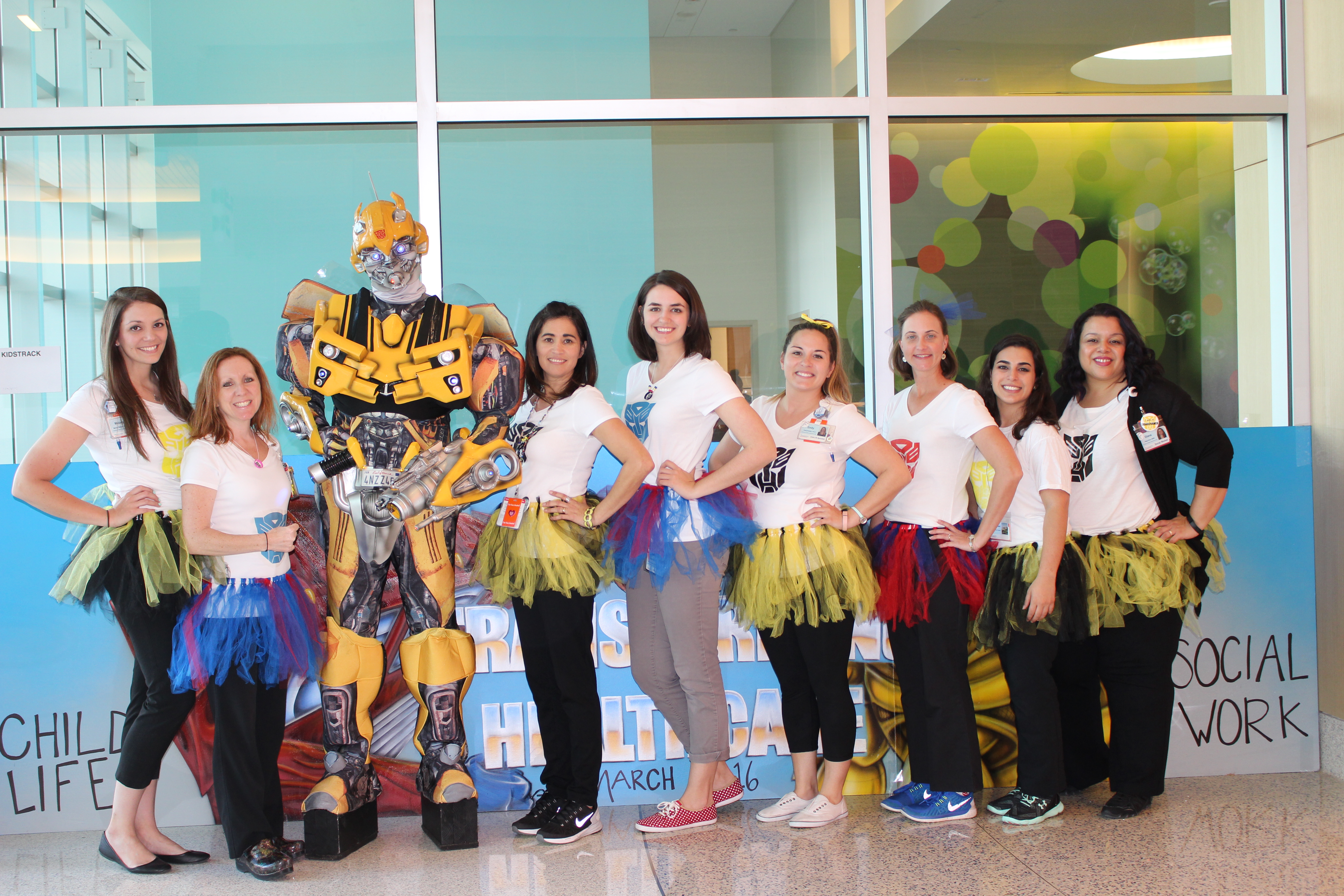 Nemours Children's Hospital Child Life and Social Work team with Bumble Bee