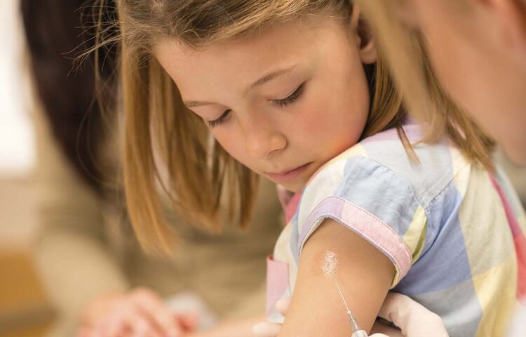 Girl receiving vaccines