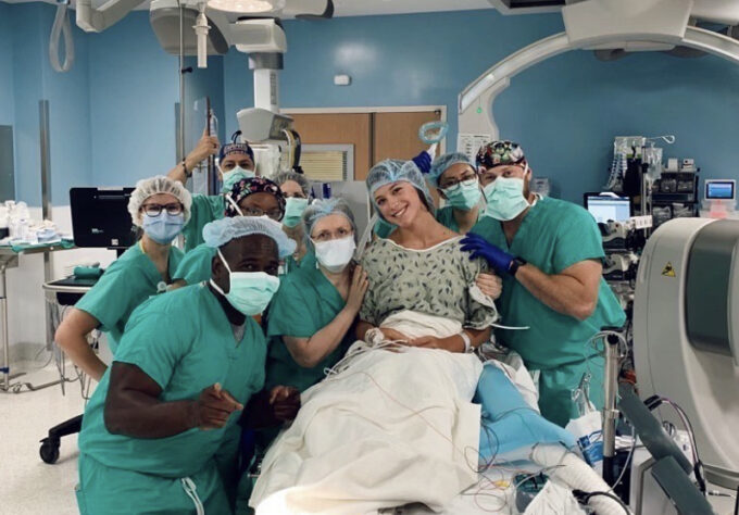 Patient surrounded by her care team