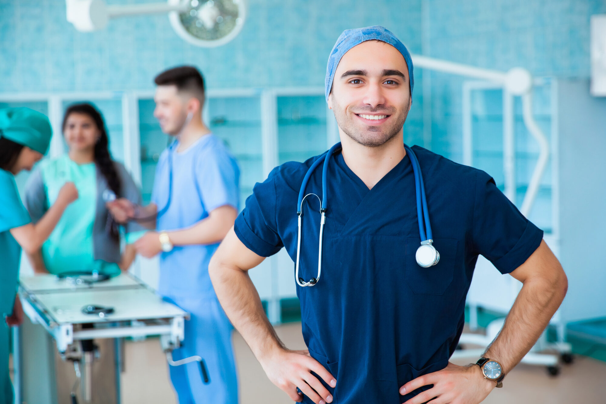 A group of graduates of a medical university in a surgical room.