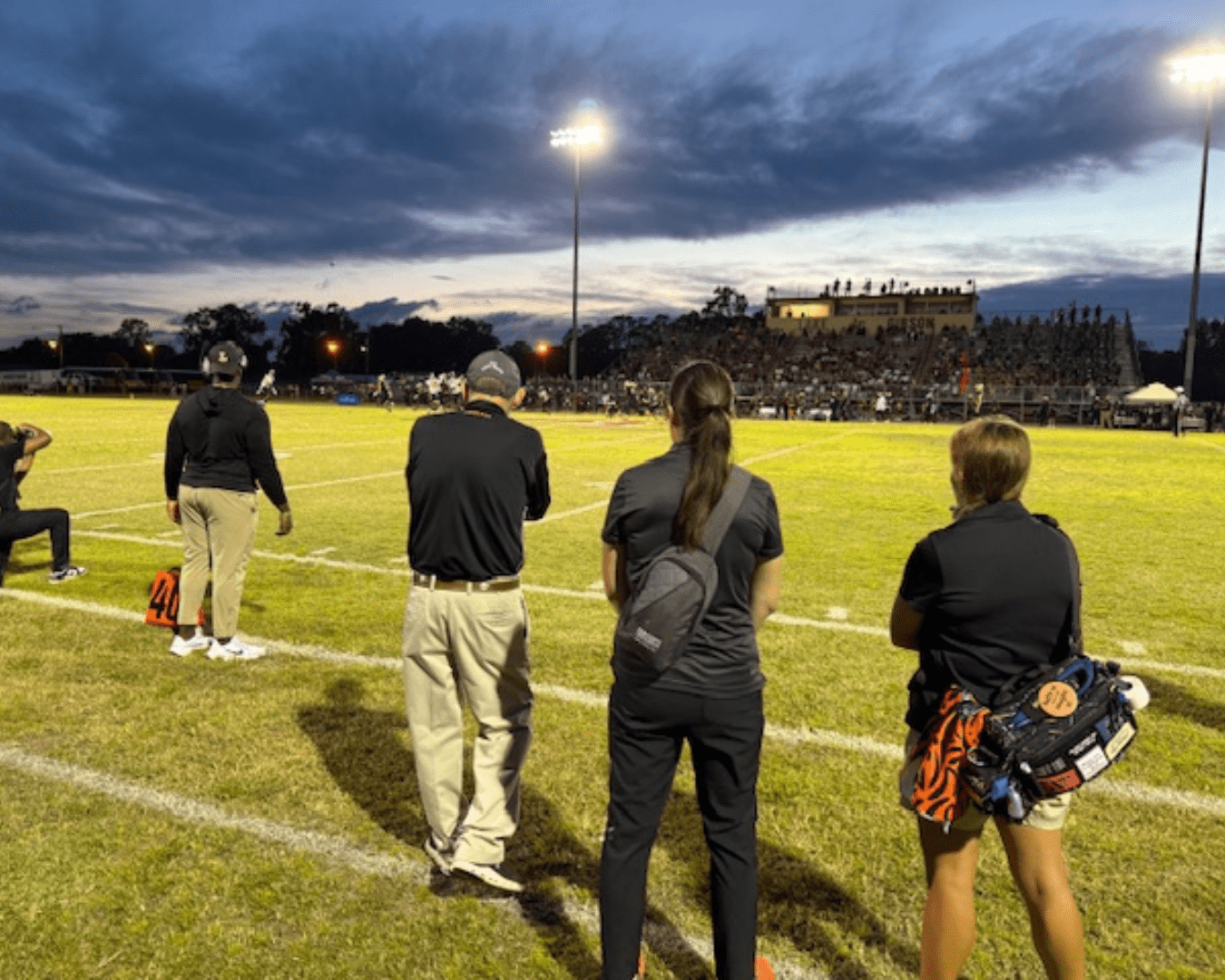 Athletic Trainers on Sideline of High School Football Game