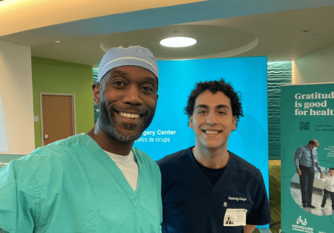 Teen patient and doctor smiling for a selfie