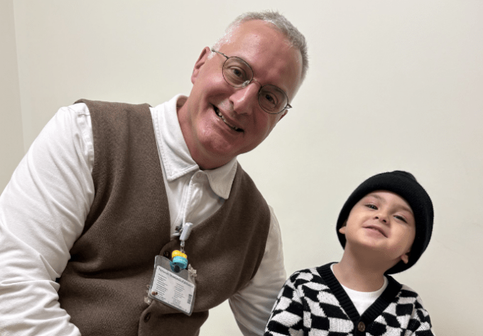 Doctor and patient smile together for a photo