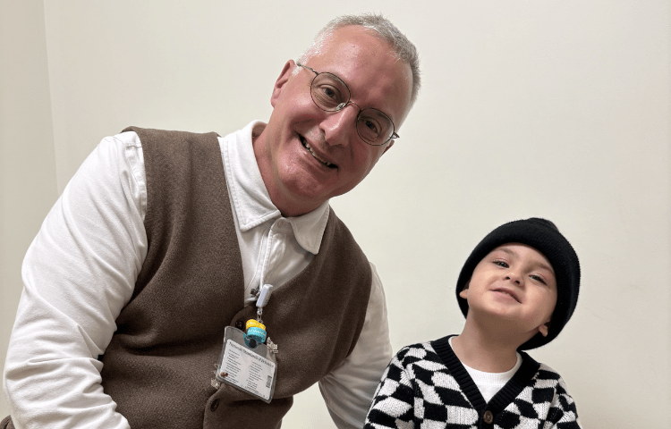Doctor and patient smile together for a photo