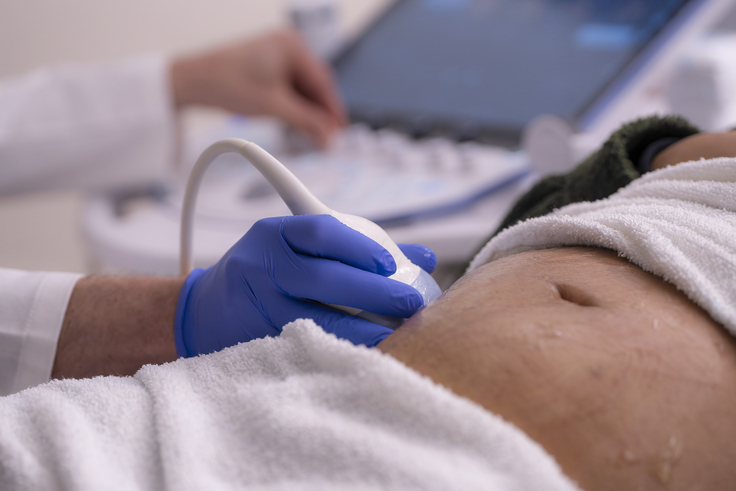 Close-up view of a prenatal ultrasound being performed as part of the evaluation and monitoring of a pregnancy.